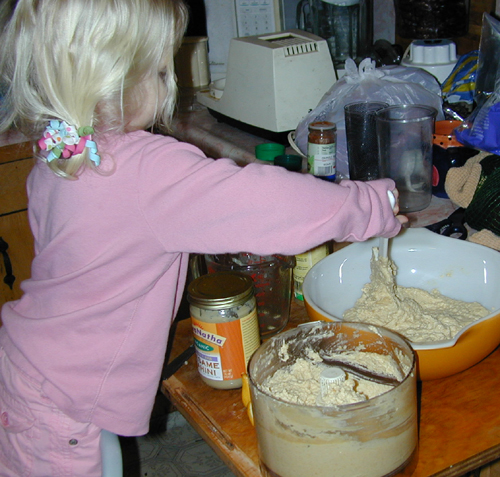 Miriam stirring hummus