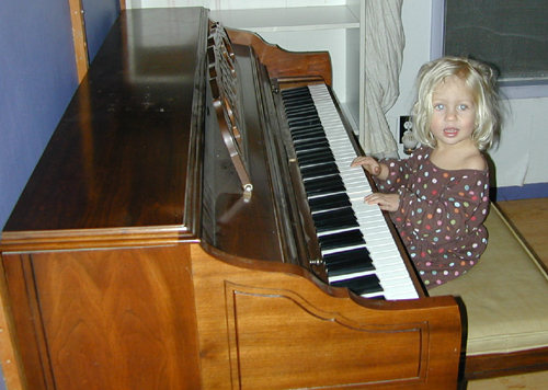 Miriam at her new piano