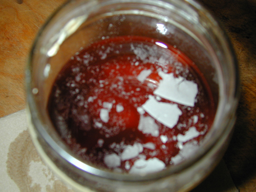 Decanting the turnip pickles, some mold on top