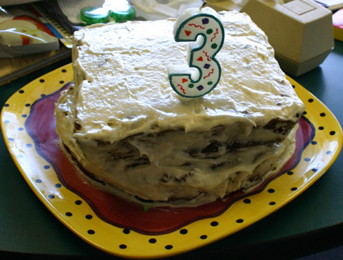 Cake frosted with a “3″candle