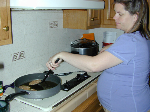 Monica frying crab cakes