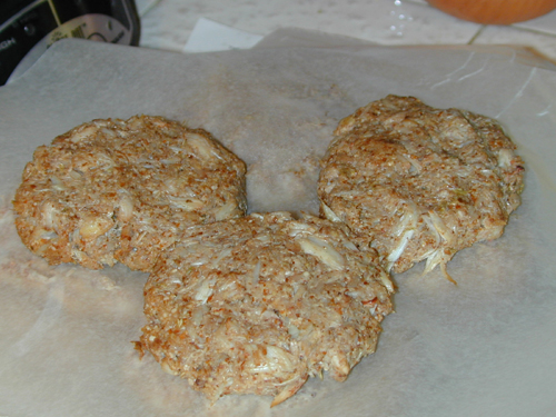 Raw crab cakes formed and ready for frying