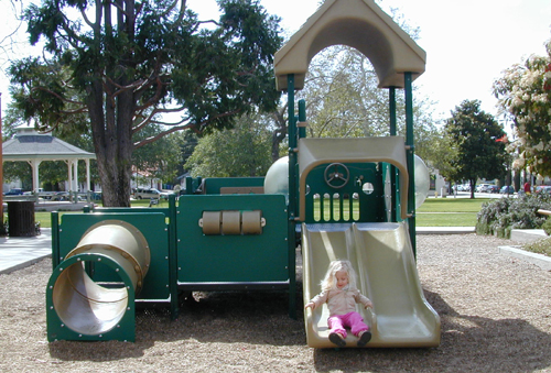 Miriam on the toddler slide at Mitchell Park, SLO