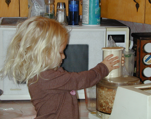 Miriam helps grind almonds for the torte crust