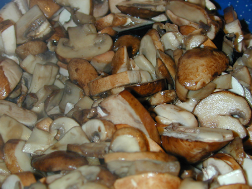 Mushrooms after being sliced and added to the pot