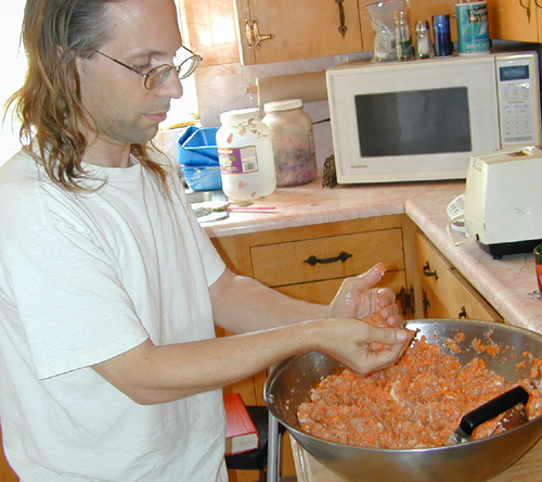 Michael forming gefilte fish into balls