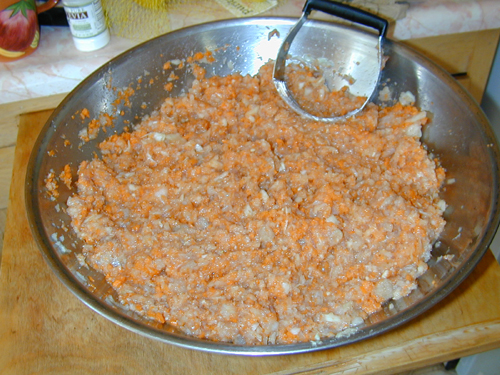 Mashing gefilte fish ingredients