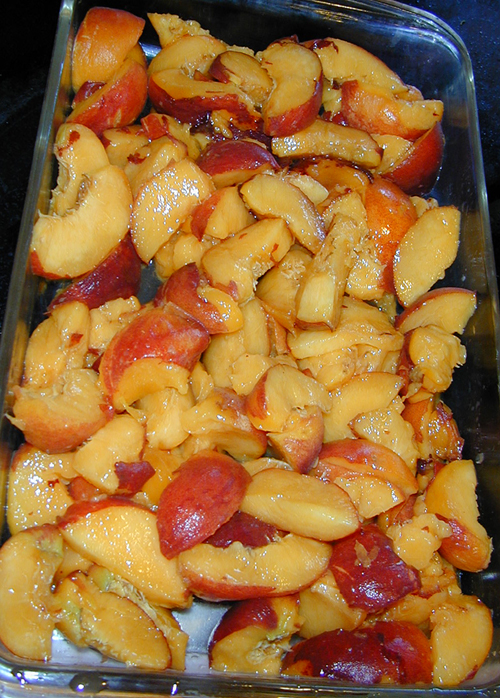 Sliced peaches in a pan