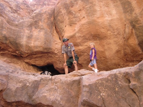 Miriam prepares to go through a tiny arch during the Fiery Furnace Tour at Arches National Park, Utah